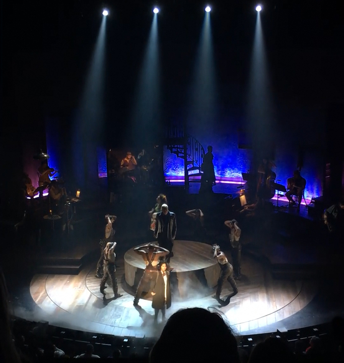 Hades loaming over Eurydice as she struggles against death